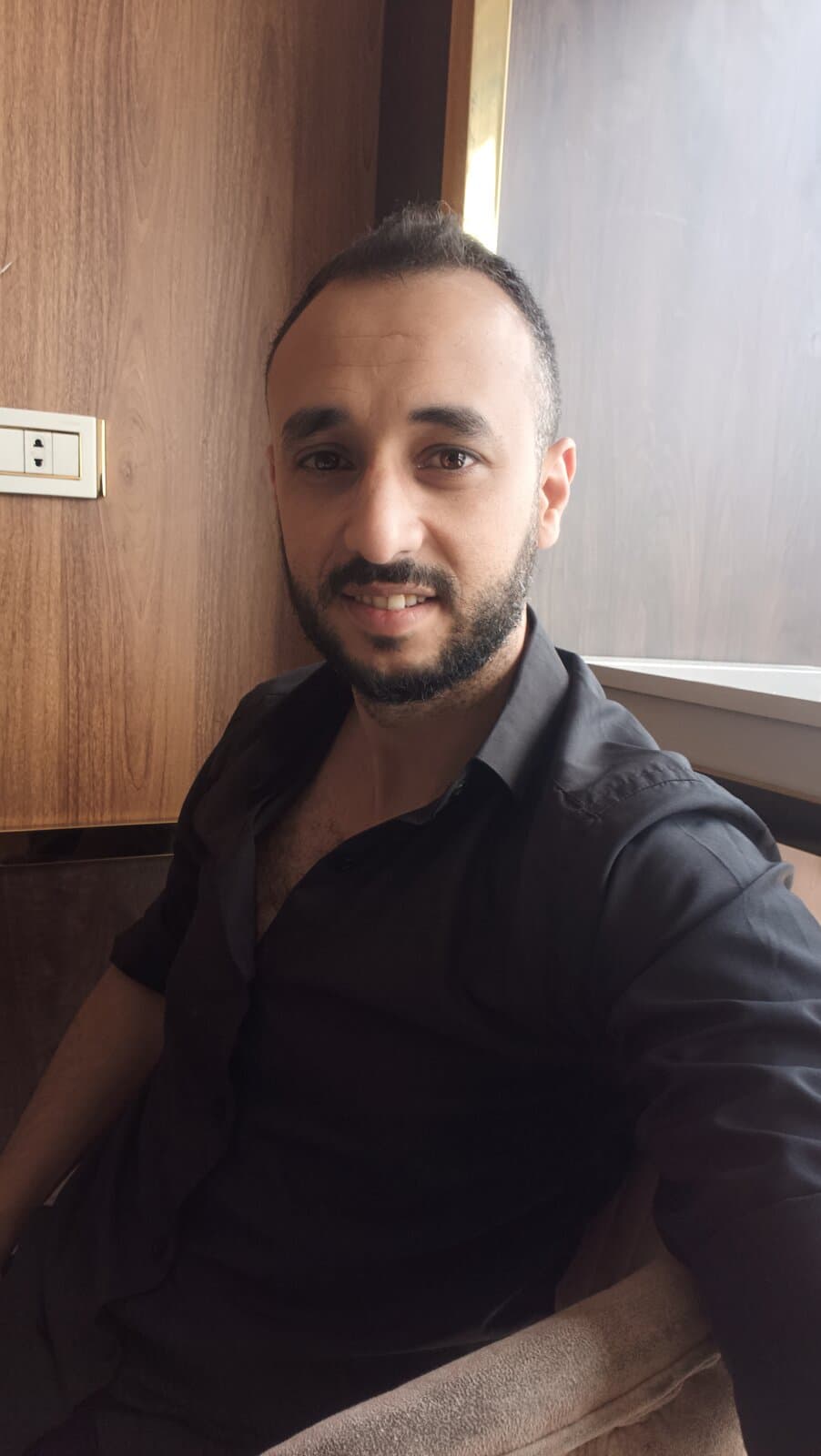 Khalid Fawzy Arafa, senior software developer, close-up portrait smiling indoors